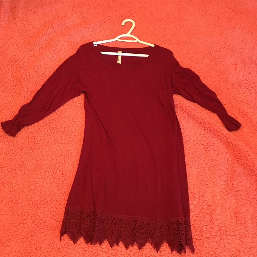 Lace trim at bottom. Quarter sleeves.